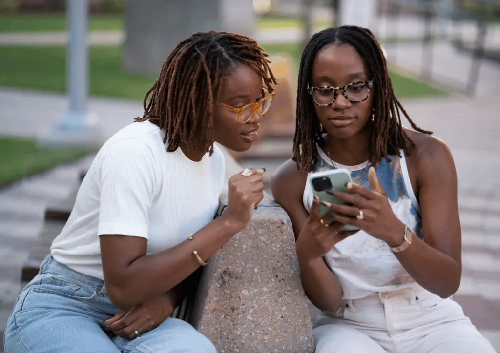 Girls checking socials