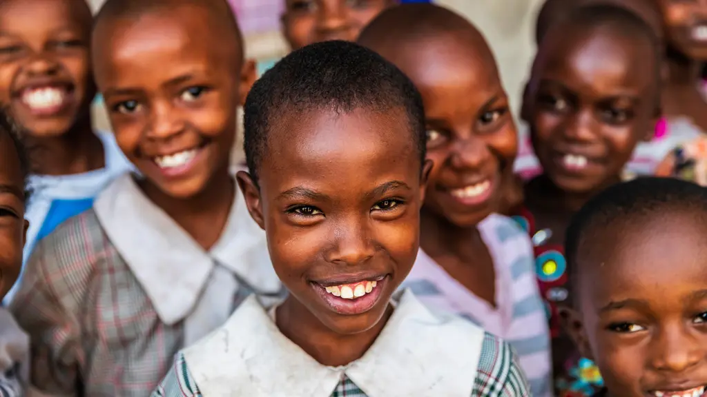 Smiling children in school uniforms, a group portrait of young African students.